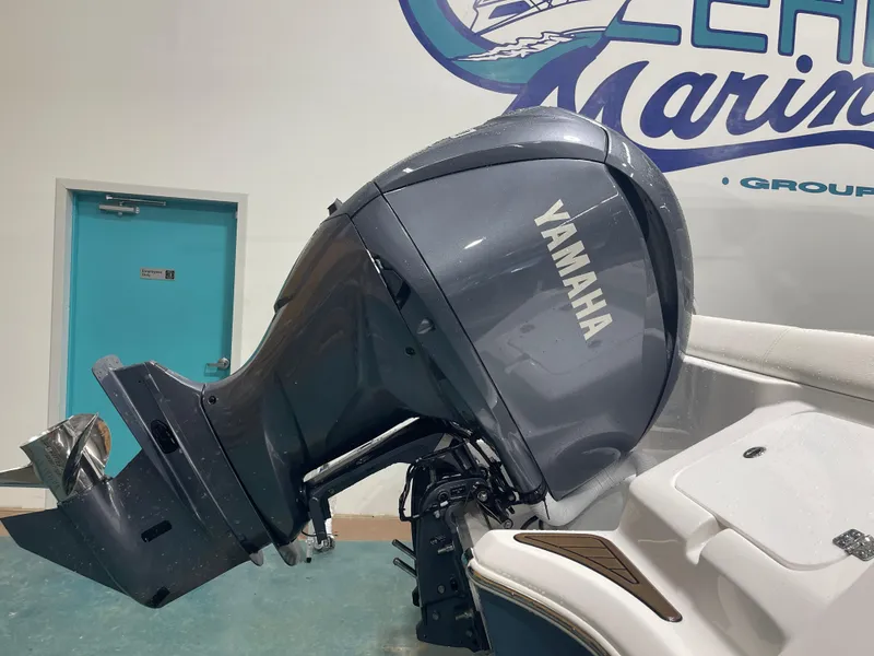 Slide: The Image of Yamaha outboard motor on 2025 Tidewater 232LXF boat in showroom. - 14