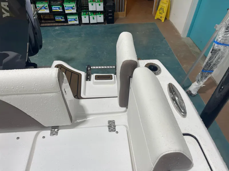 Slide: The Image of 2025 Tidewater 232LXF boat interior with wet seating and storage compartments. - 19