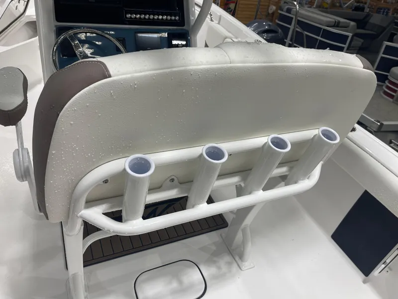 Slide: The Image of 2025 Tidewater 232LXF boat interior with rod holders and steering console. - 20