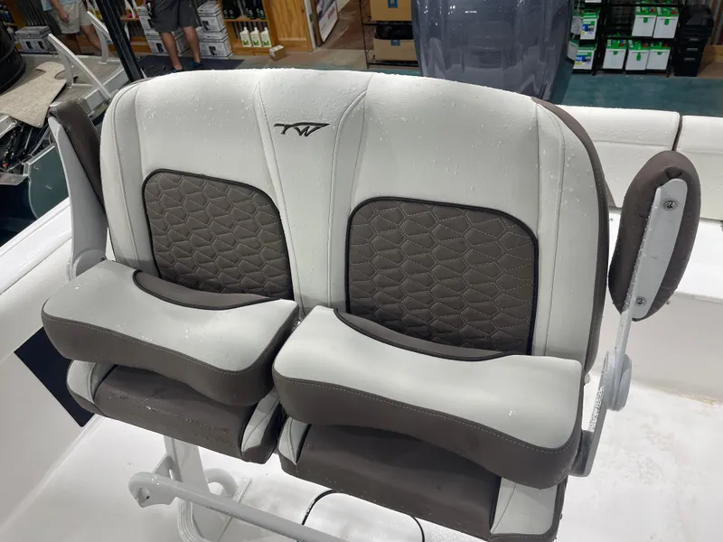 Slide: The Image of 2025 Tidewater 232LXF boat seats with wet upholstery in showroom. - 22
