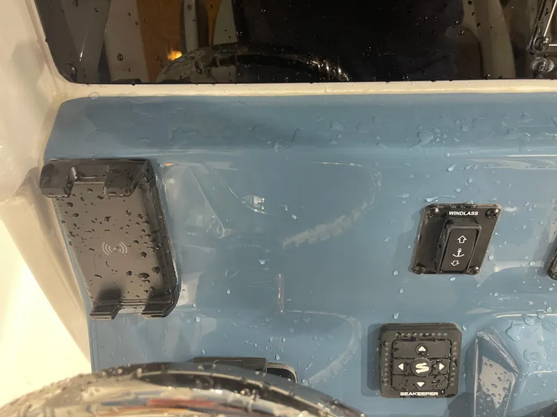 Slide: The Image of Control panel of 2025 Tidewater 232LXF boat with wet surface and buttons. - 25