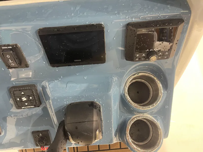 Slide: The Image of 2025 Tidewater 232LXF boat dashboard with Yamaha display and JL Audio system. - 26