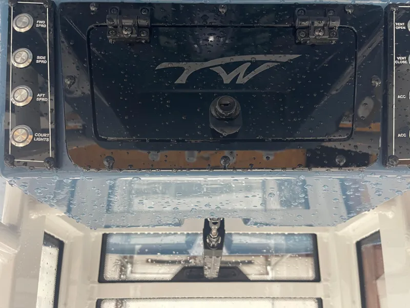 Slide: The Image of 2025 Tidewater 232LXF boat dashboard with control panel and switches. - 30
