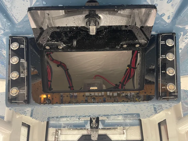 Slide: The Image of Control panel of 2025 Tidewater 232LXF boat with wiring and switches. - 31