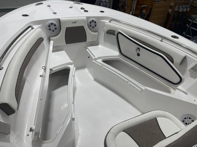 Slide: The Image of 2025 Tidewater 232LXF boat interior with seating and storage compartments. - 33
