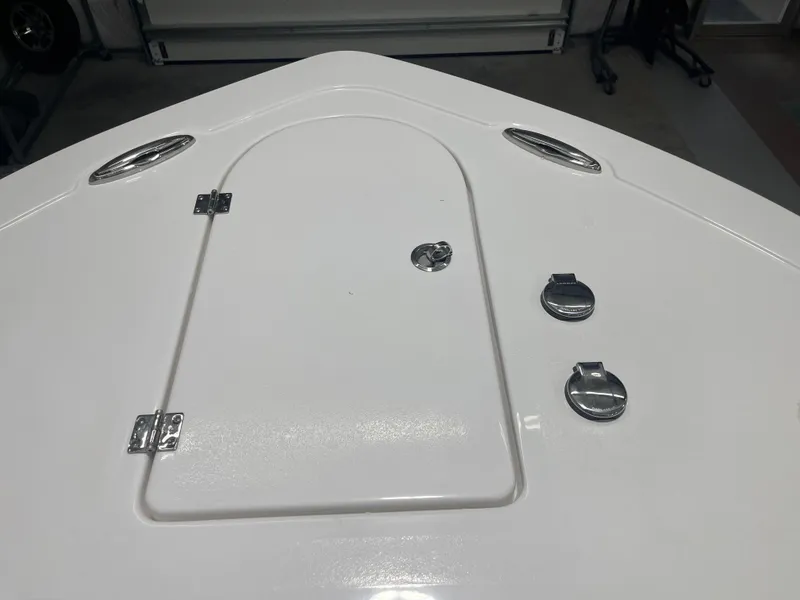 Slide: The Image of 2025 Tidewater 232LXF boat deck with hatch and chrome fittings. - 34
