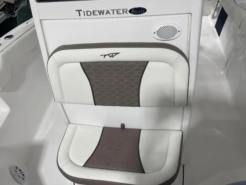 Slide: The Image of 2025 Tidewater 232LXF boat seat with brown and white upholstery. - 38