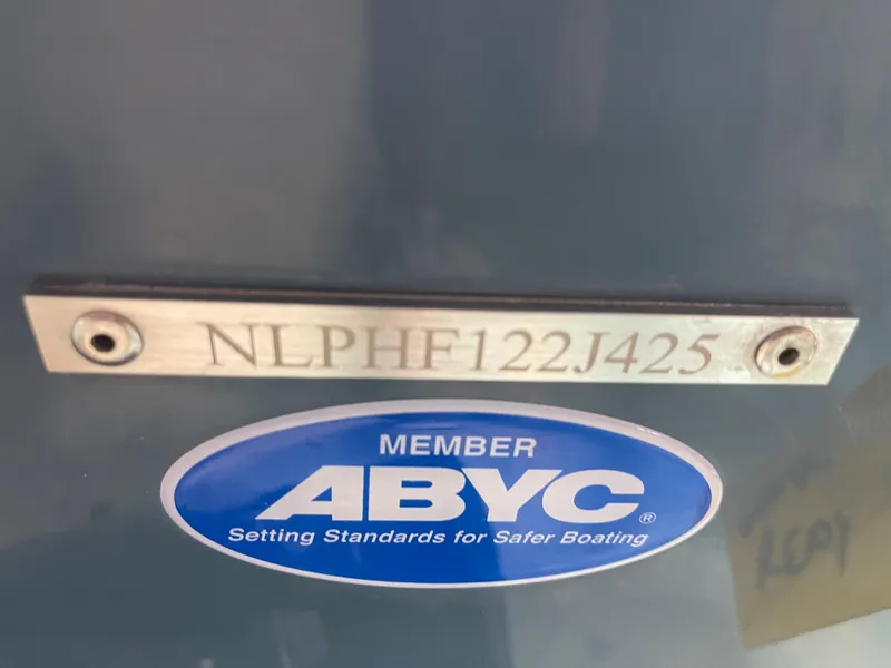 Slide: The Image of Tidewater 232LXF 2025 boat with ABYC member sticker and serial number plate. - 45