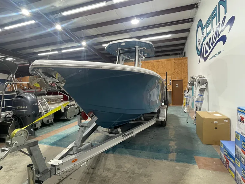 Slide: The Image of 2025 Tidewater 232LXF boat in showroom, on trailer, with Yamaha engine. - 5