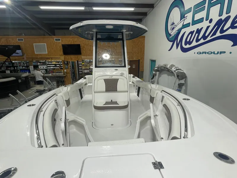 Slide: The Image of 2025 Tidewater 232LXF boat interior at dealership showroom. - 6