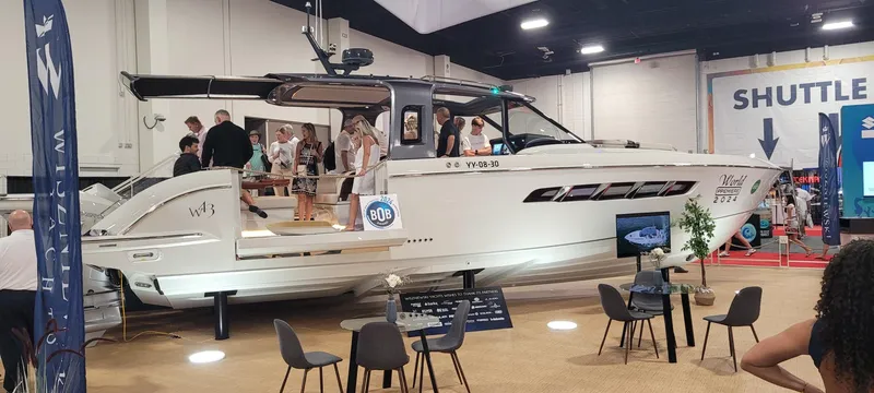 The Image of 2024 Wiszniewski Yachts W43 on display at a boat show, featuring sleek design and modern amenities. - 1