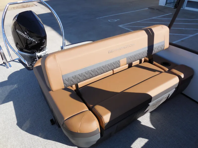 Slide: The Image of 2025 Bennington 26 MSB boat with tan seating and Mercury outboard motor. - 11