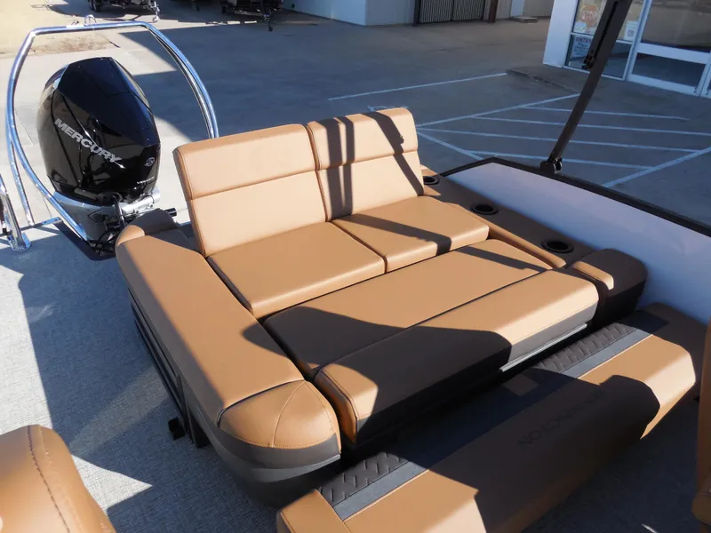 Slide: The Image of 2025 Bennington 26 MSB boat with tan seating and Mercury outboard motor. - 13