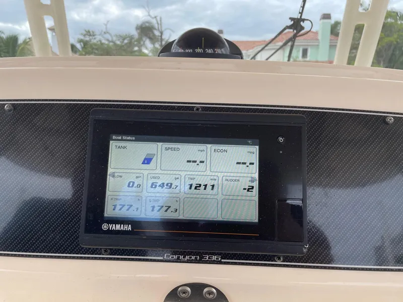 Slide: The Image of Dashboard of 2019 Grady-White Canyon 336 boat with Yamaha display showing fuel stats. - 10