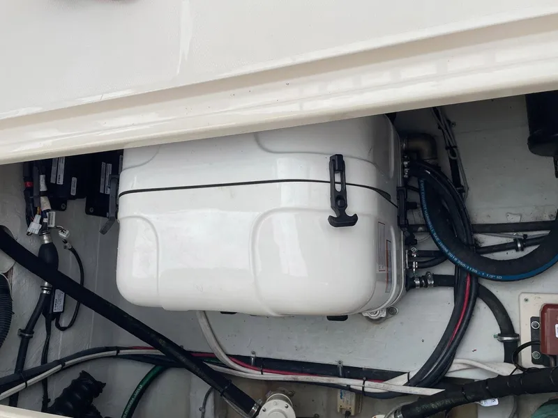 Slide: The Image of Engine compartment of 2019 Grady-White Canyon 336 boat, showing mechanical components and wiring. - 15