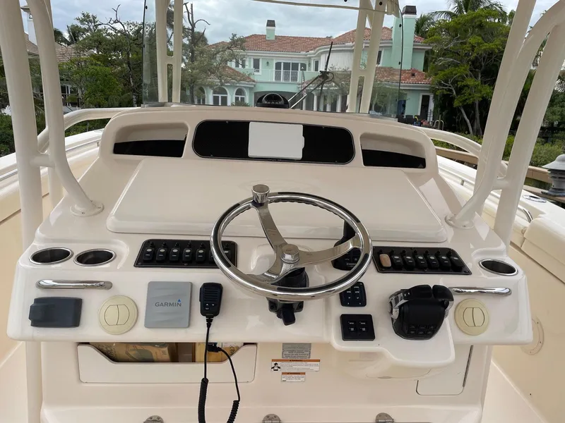 Slide: The Image of 2019 Grady-White Canyon 336 boat helm with steering wheel and controls. - 8