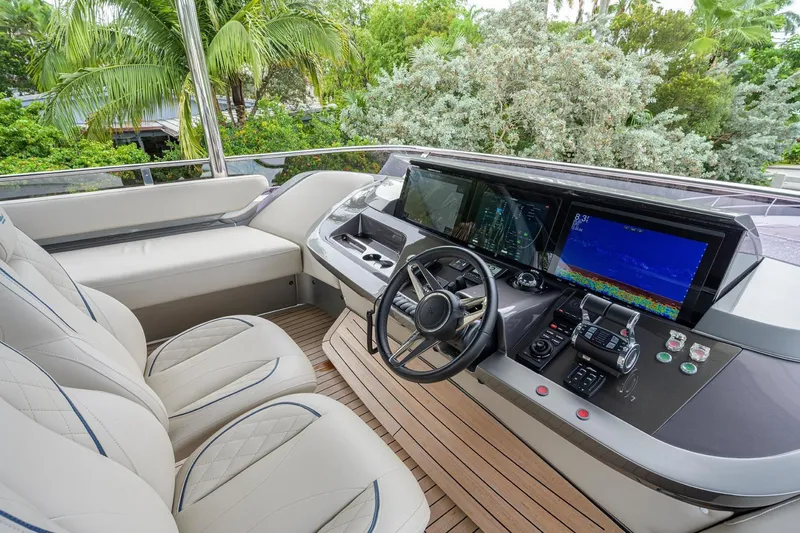 Slide: The Image of Luxurious 2022 Princess Y85 Motor Yacht helm with modern navigation systems and plush seating. - 10