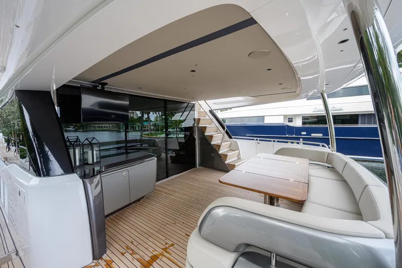 Slide: The Image of Luxurious 2022 Princess Y85 Motor Yacht deck with seating and modern amenities. - 15