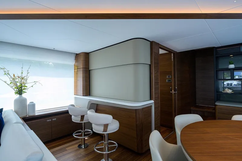Slide: The Image of Luxurious interior of 2022 Princess Y85 Motor Yacht with modern seating and elegant decor. - 23