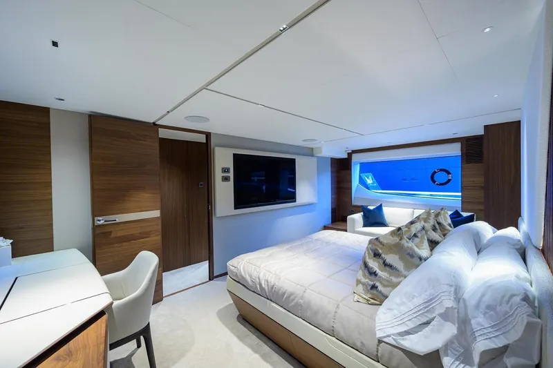 Slide: The Image of Luxurious bedroom interior of 2022 Princess Y85 Motor Yacht with modern decor and large window. - 31