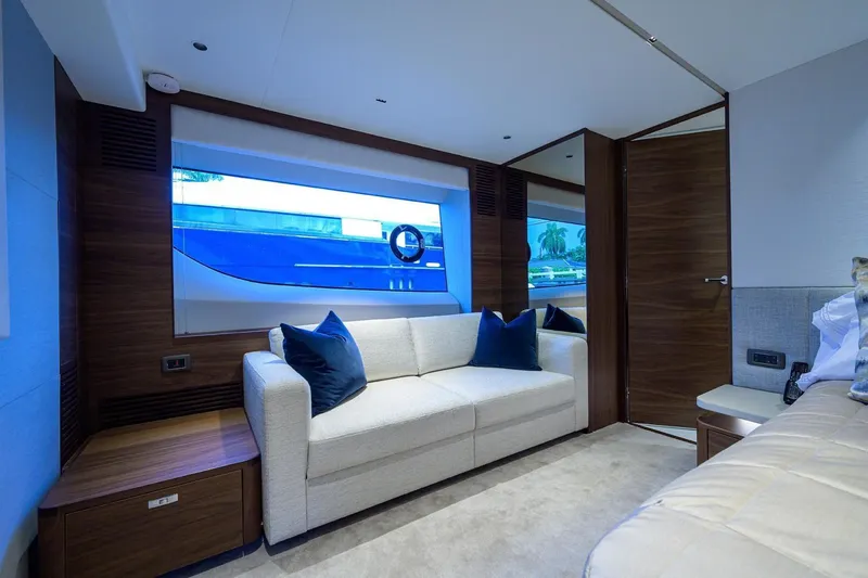 Slide: The Image of Luxurious interior of 2022 Princess Y85 Motor Yacht with modern seating and large window. - 33