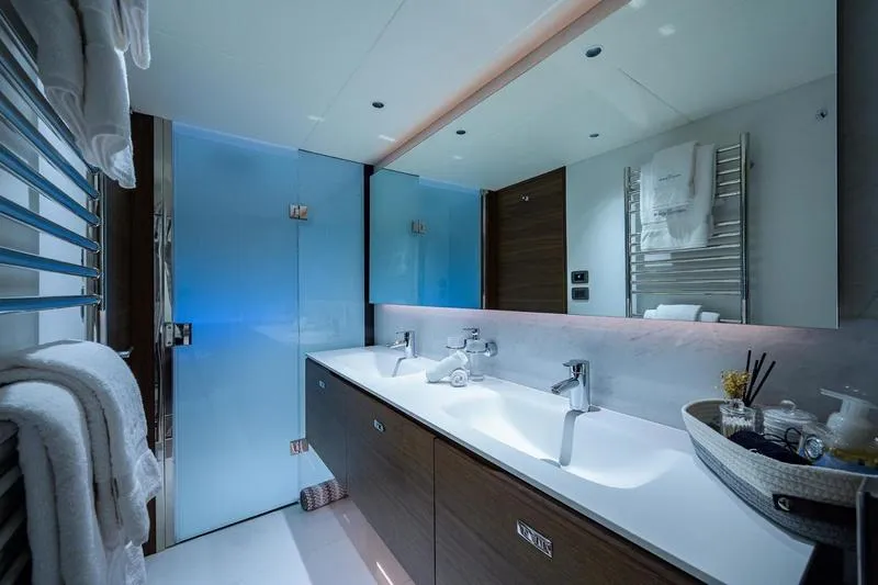 Slide: The Image of Luxurious bathroom on 2022 Princess Y85 Motor Yacht with dual sinks and modern design. - 35