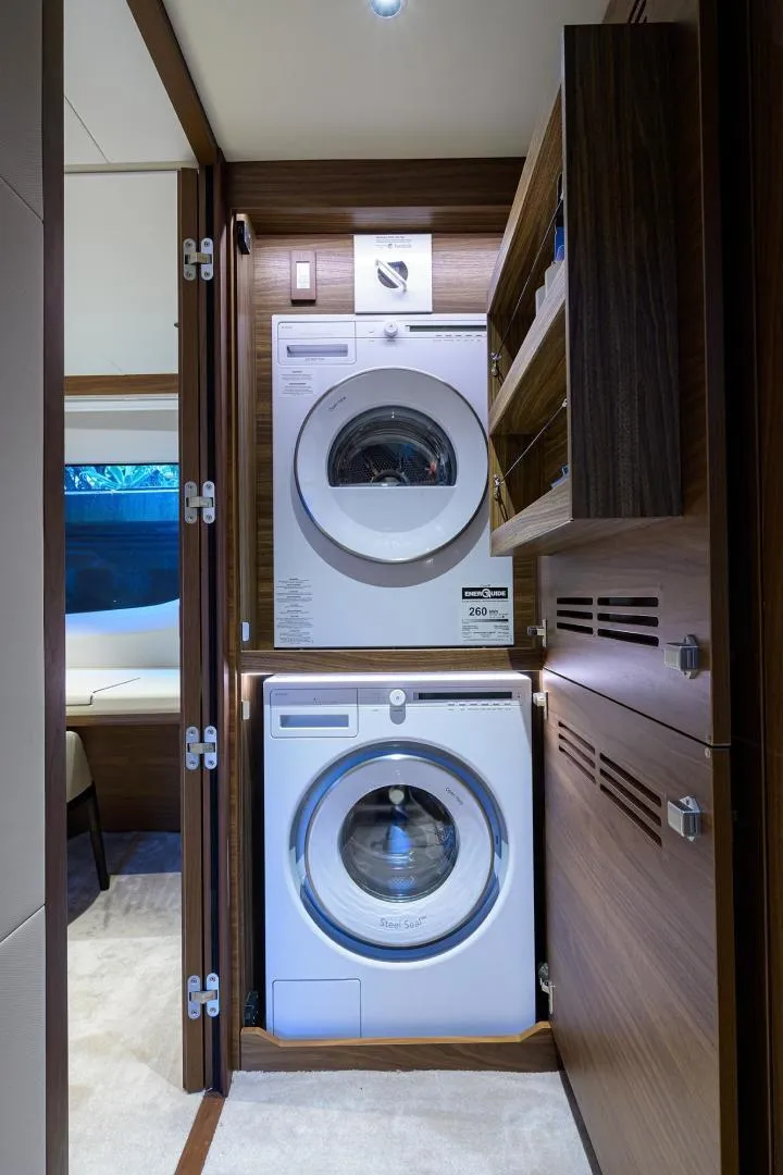 Slide: The Image of Laundry area with washer and dryer on 2022 Princess Y85 Motor Yacht. - 36
