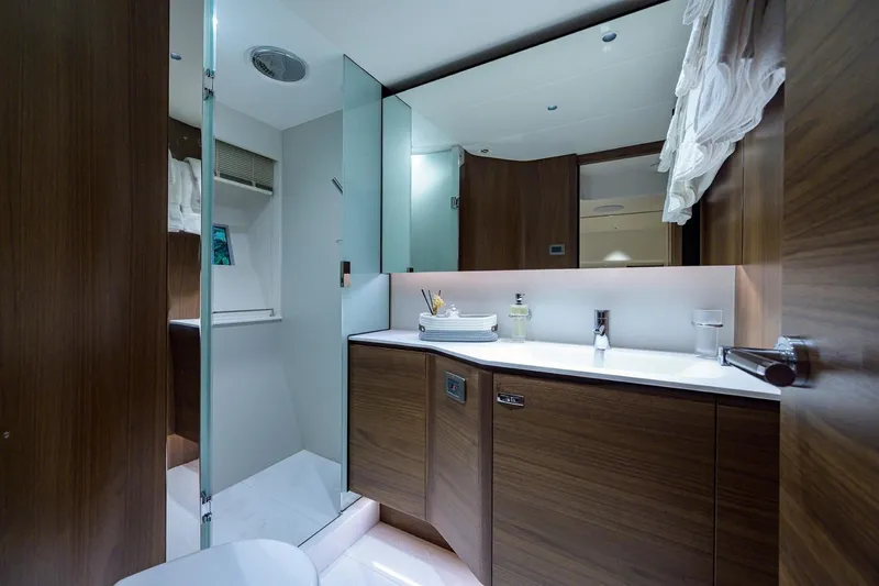 Slide: The Image of Luxurious bathroom on 2022 Princess Y85 Motor Yacht with modern wood cabinetry. - 39