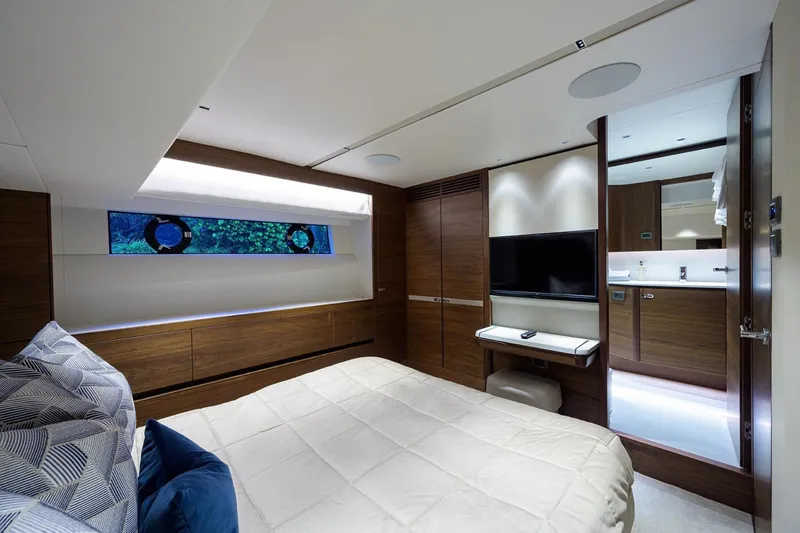 Slide: The Image of Luxurious bedroom in 2022 Princess Y85 Motor Yacht with modern decor and TV. - 40