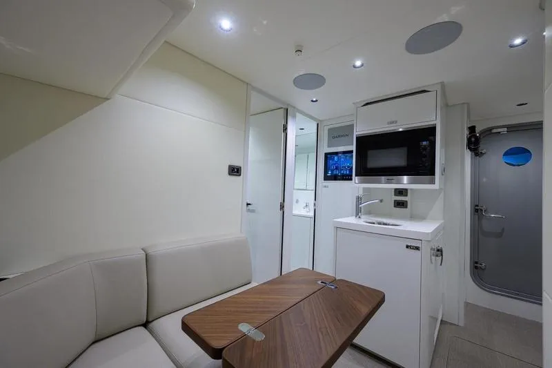 Slide: The Image of Modern interior of 2022 Princess Y85 Motor Yacht with kitchenette and seating area. - 42