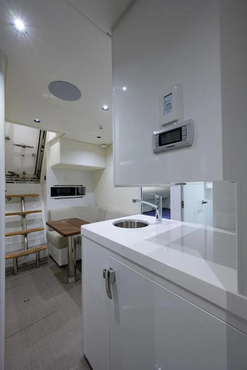 Slide: The Image of Modern interior of 2022 Princess Y85 Motor Yacht with sleek white cabinetry. - 43
