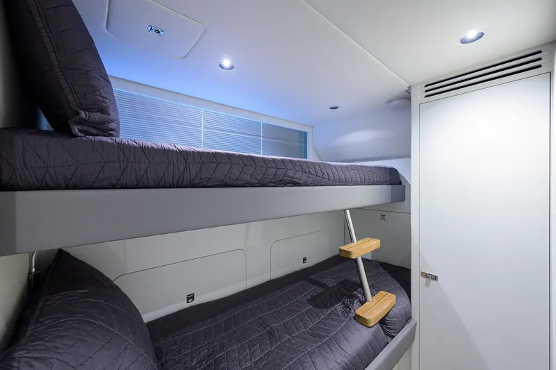 Slide: The Image of Bunk beds in 2022 Princess Y85 Motor Yacht cabin, modern design with sleek lighting. - 47