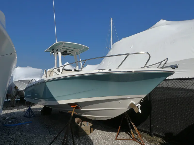 The Image of 2025 Boston Whaler 250 Dauntless boat on stands, outdoor storage. - 0