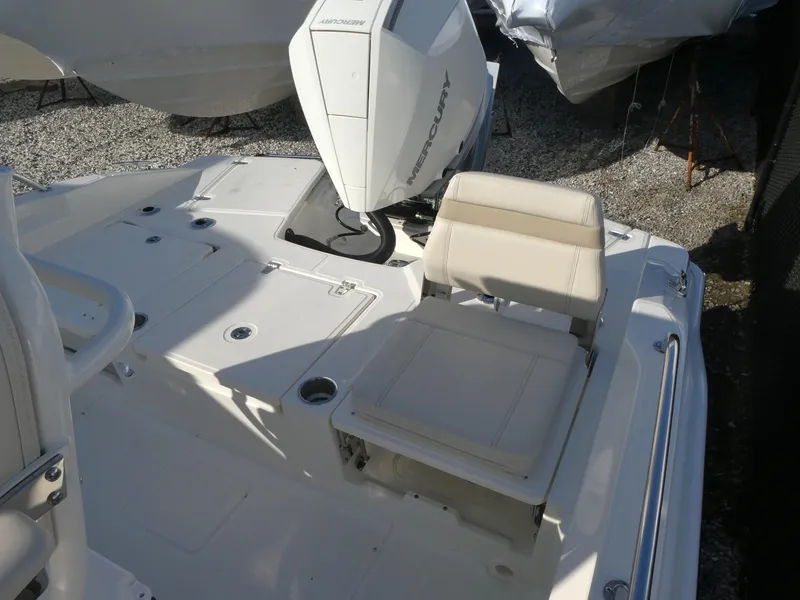 Slide: The Image of 2025 Boston Whaler 250 Dauntless boat deck with seating and Mercury outboard motor. - 11
