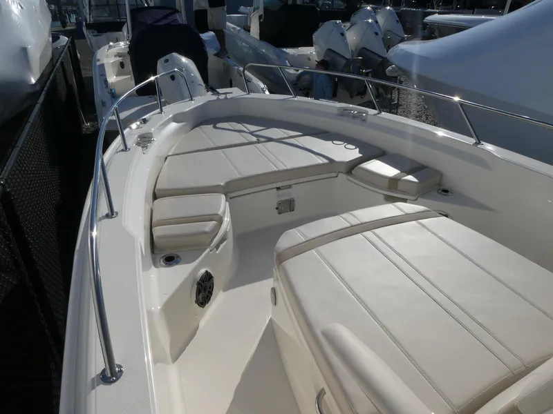 Slide: The Image of 2025 Boston Whaler 250 Dauntless boat interior with spacious seating and sleek design. - 4