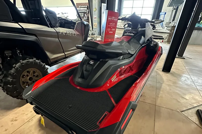 Slide: The Image of 2025 Yamaha WaveRunner VX Deluxe in showroom, red and black design. - 8