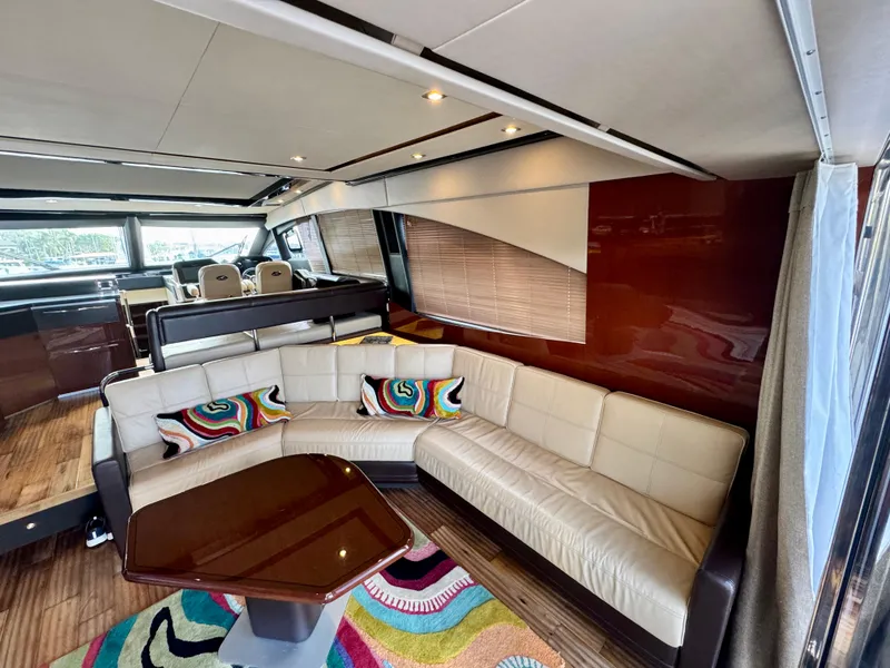 Slide: The Image of Luxurious interior of 2017 Sea Ray L590 yacht with plush seating and vibrant decor. - 10