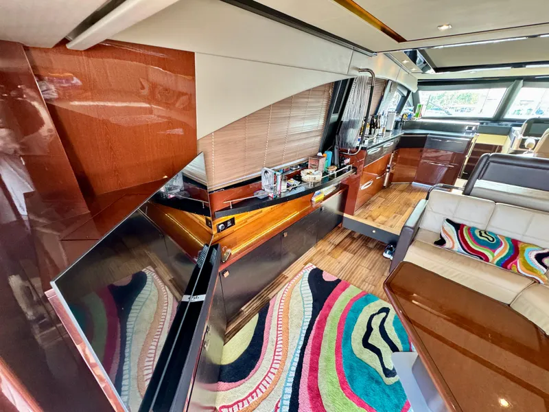 Slide: The Image of Luxurious interior of 2017 Sea Ray L590 yacht with modern design and vibrant decor. - 11