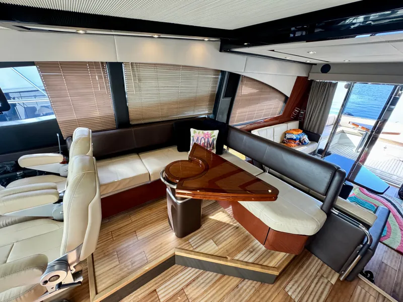 Slide: The Image of Luxurious interior of 2017 Sea Ray L590 yacht with elegant seating and wooden accents. - 13