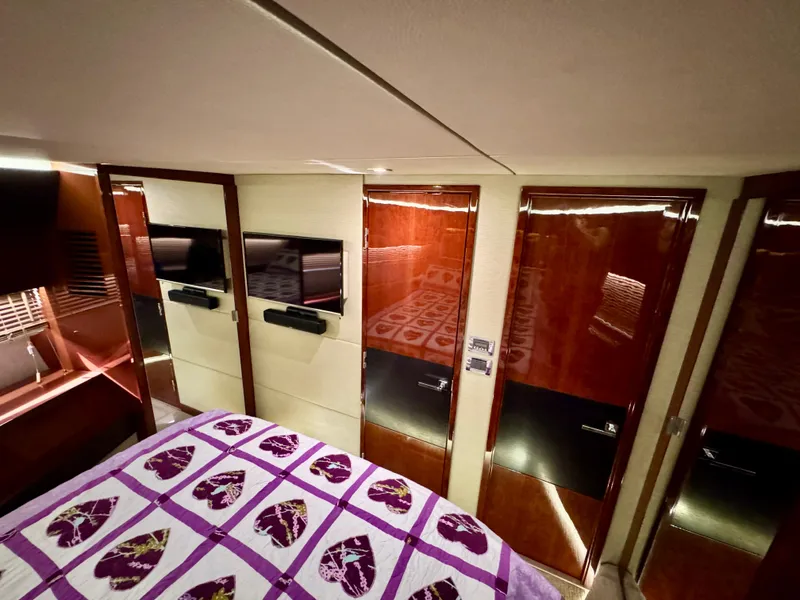 Slide: The Image of Luxurious cabin interior of 2017 Sea Ray L590 yacht with elegant wood finishes. - 22