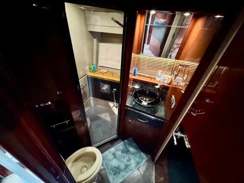 Slide: The Image of Luxurious bathroom in 2017 Sea Ray L590 yacht with modern fixtures and elegant design. - 25