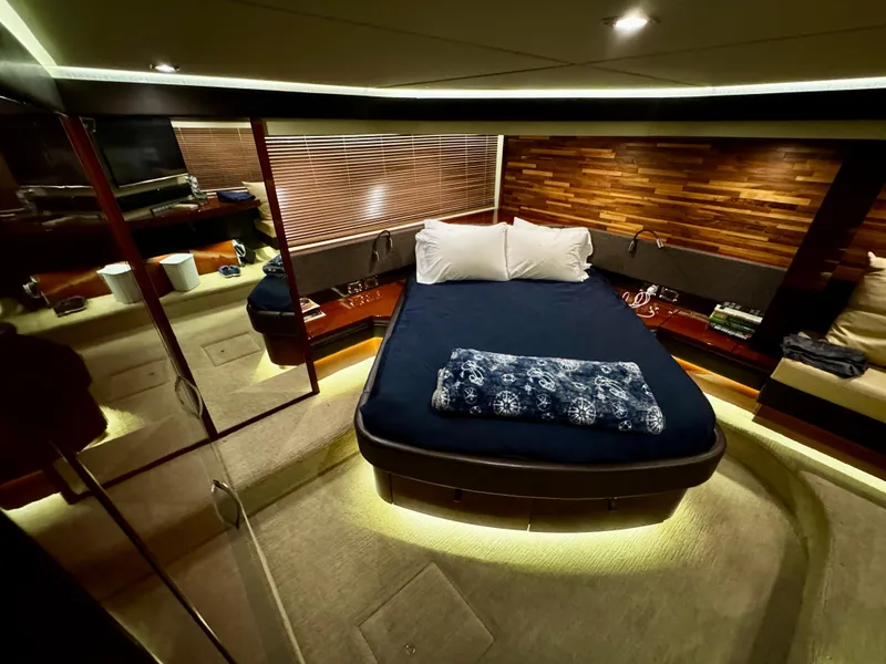 Slide: The Image of Luxurious 2017 Sea Ray L590 yacht bedroom with modern design and ambient lighting. - 31