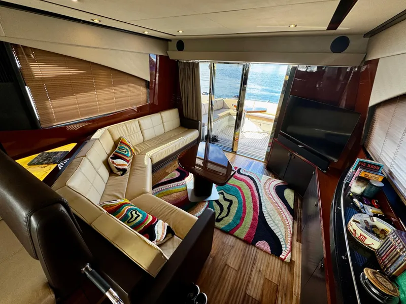 Slide: The Image of Luxurious interior of 2017 Sea Ray L590 yacht with modern decor and vibrant accents. - 35