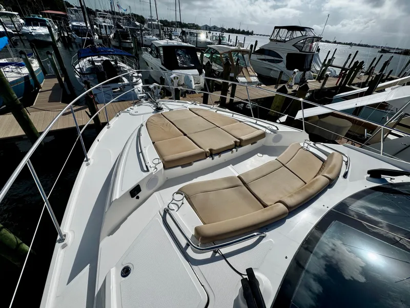 Slide: The Image of 2017 Sea Ray L590 yacht with sun loungers docked at marina. - 37