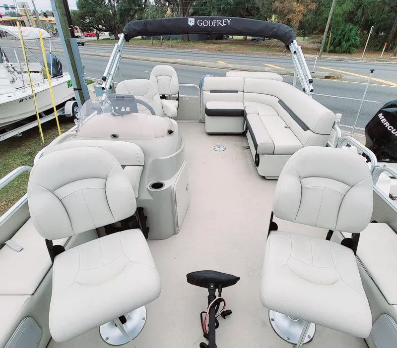 Slide: The Image of 2021 Godfrey SR 160 F pontoon boat with spacious seating and modern design. - 6