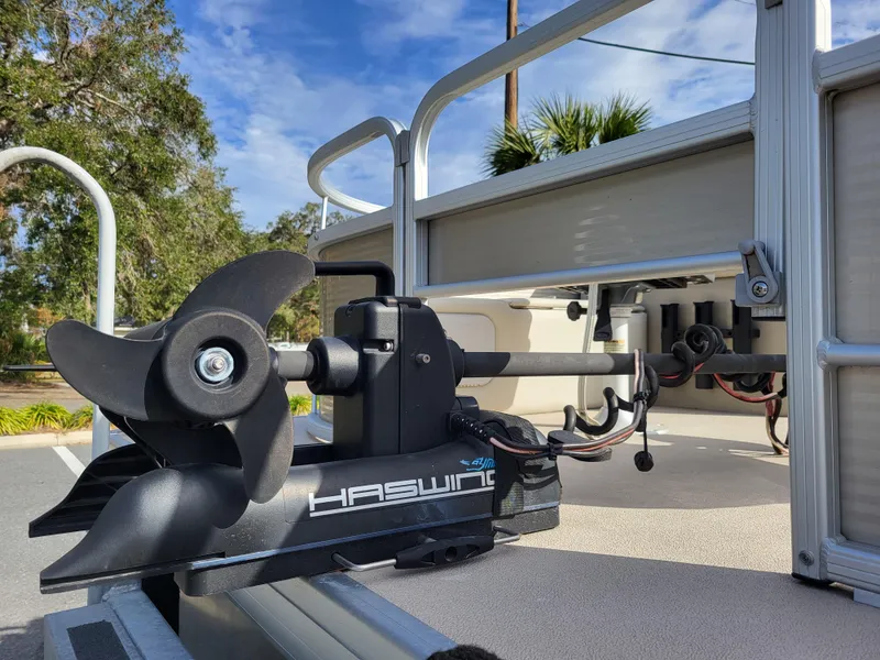 Slide: The Image of Haswing motor on 2021 Godfrey SR 160 F boat, outdoor setting. - 9