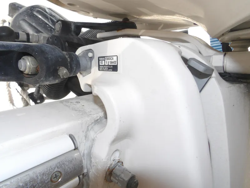 Slide: The Image of Close-up of a Yamaha F300XCA engine part on a 2020 Cobia 320 Center Console boat. - 13