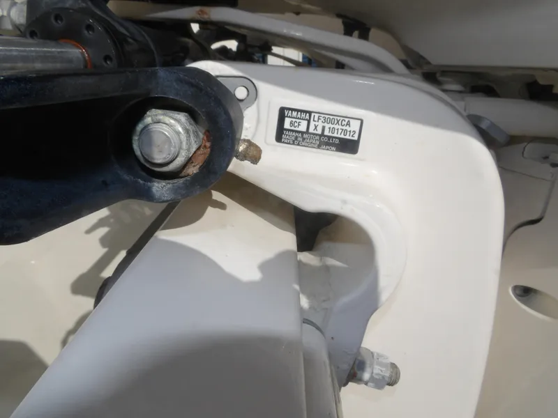 Slide: The Image of Close-up of Yamaha LF300XCA engine part on 2020 Cobia 320 Center Console boat. - 14