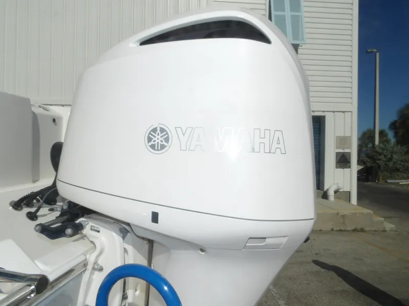 Slide: The Image of Yamaha outboard engine on a 2020 Cobia 320 Center Console boat. - 16