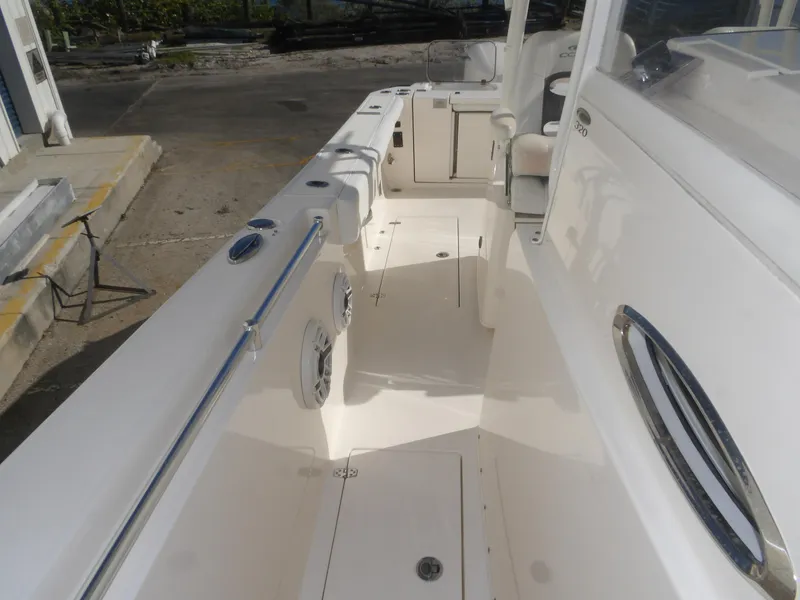 Slide: The Image of 2020 Cobia 320 Center Console boat interior, featuring spacious deck and sleek design. - 30